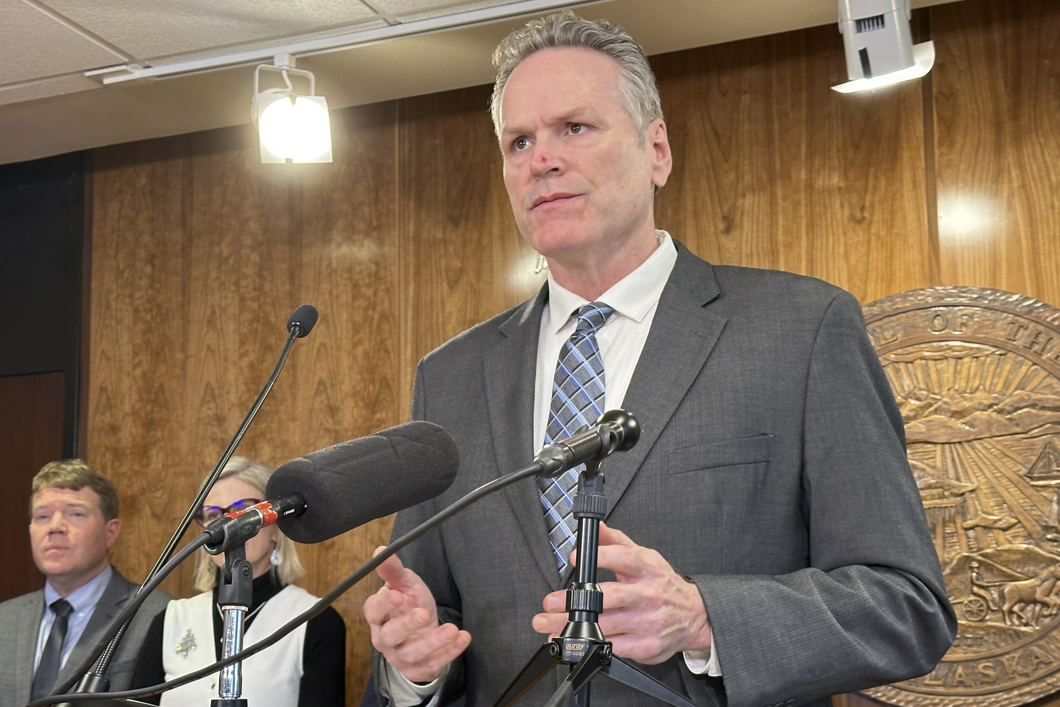Alaska Gov. Mike Dunleavy (R) holds a news conference.