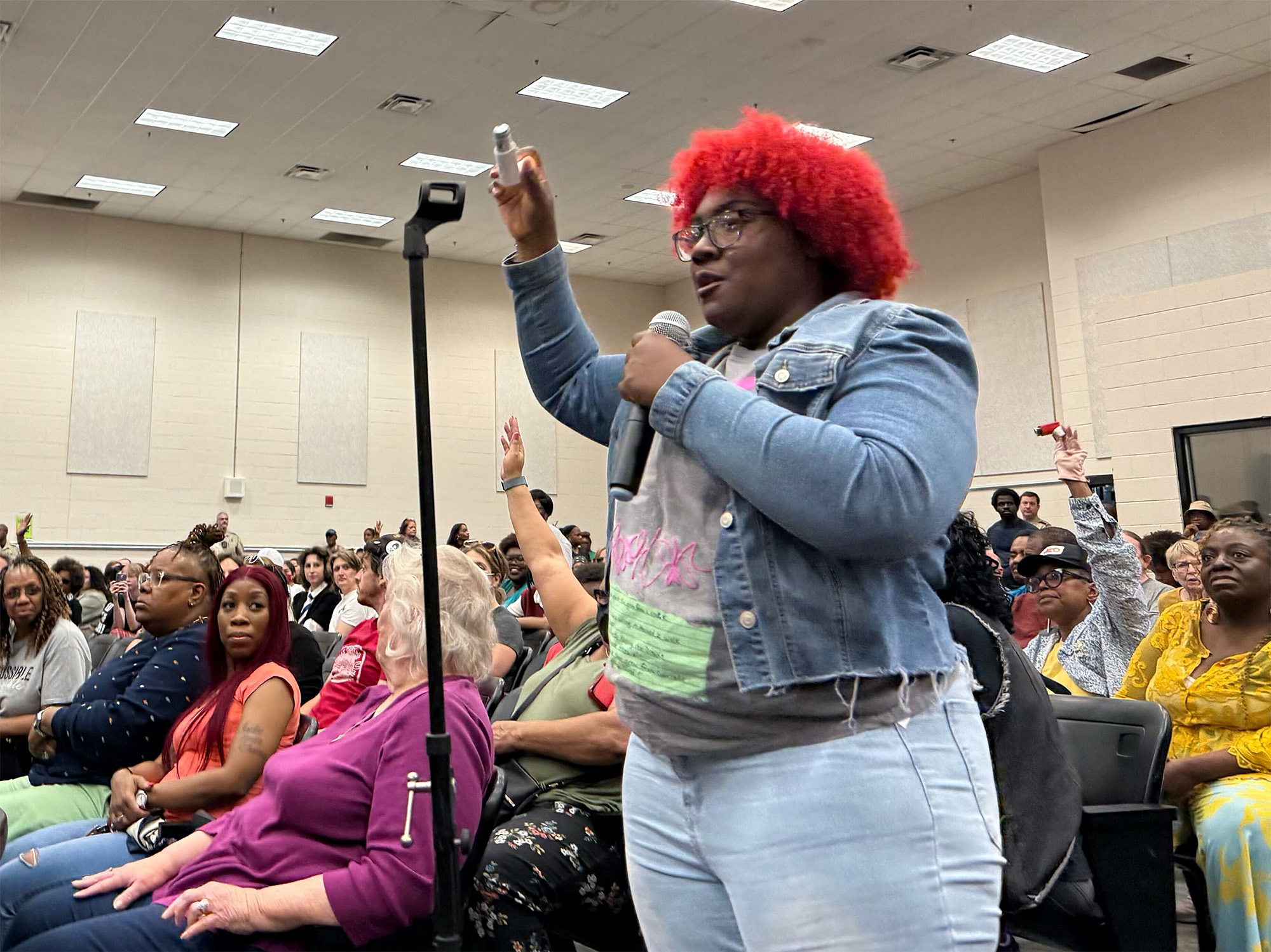 Alexis Humphreys holds out her asthma inhaler while asking the Shelby County Health Department to deny a permit for xAI’s methane gas turbines Alexis Humphreys holds out her asthma inhaler while asking the Shelby County Health Department to deny a permit for xAI’s methane gas turbines