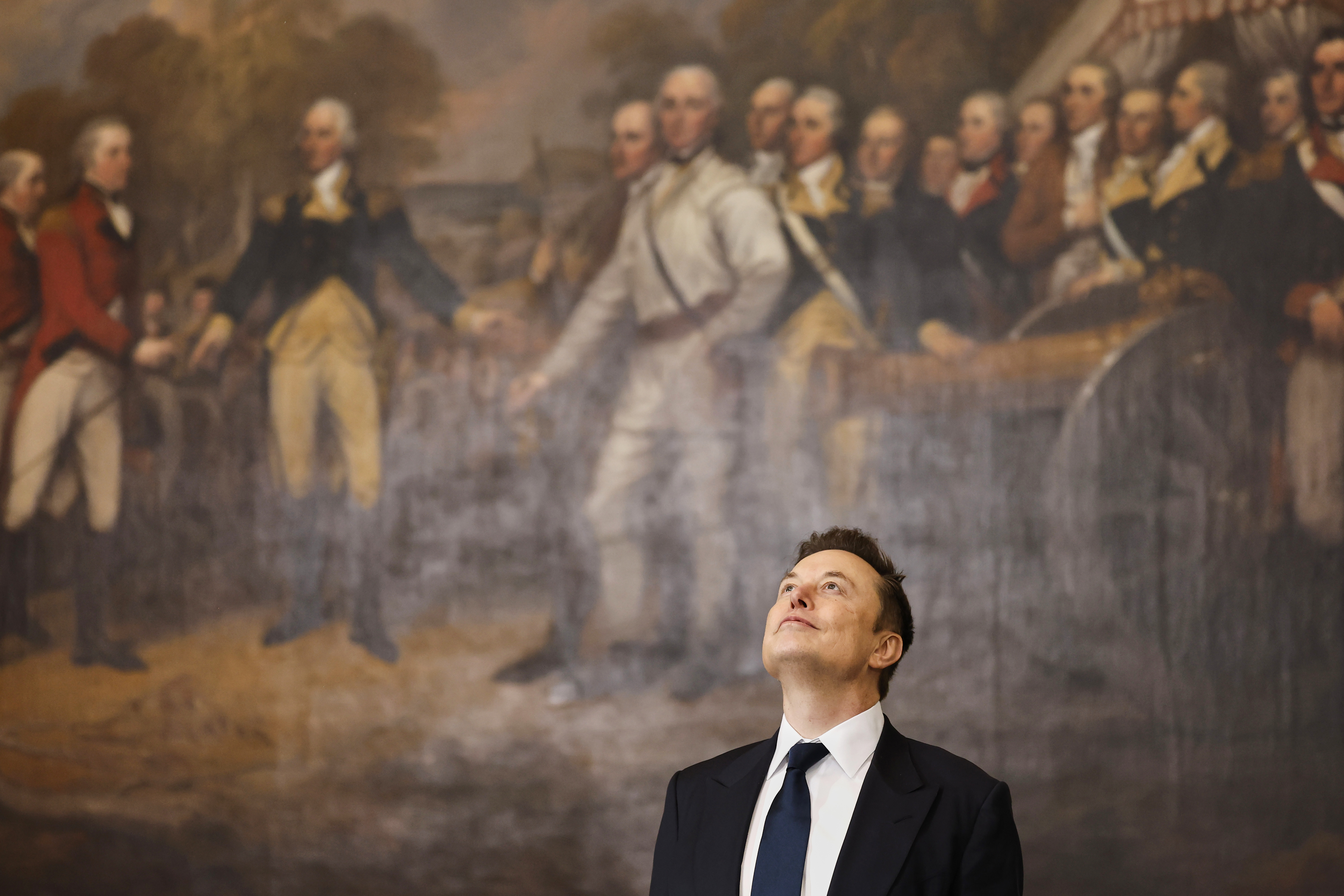 Elon Musk looks up in the Capitol Rotunda before Donald Trump's inauguration. Elon Musk looks up in the Capitol Rotunda before Donald Trump's inauguration.