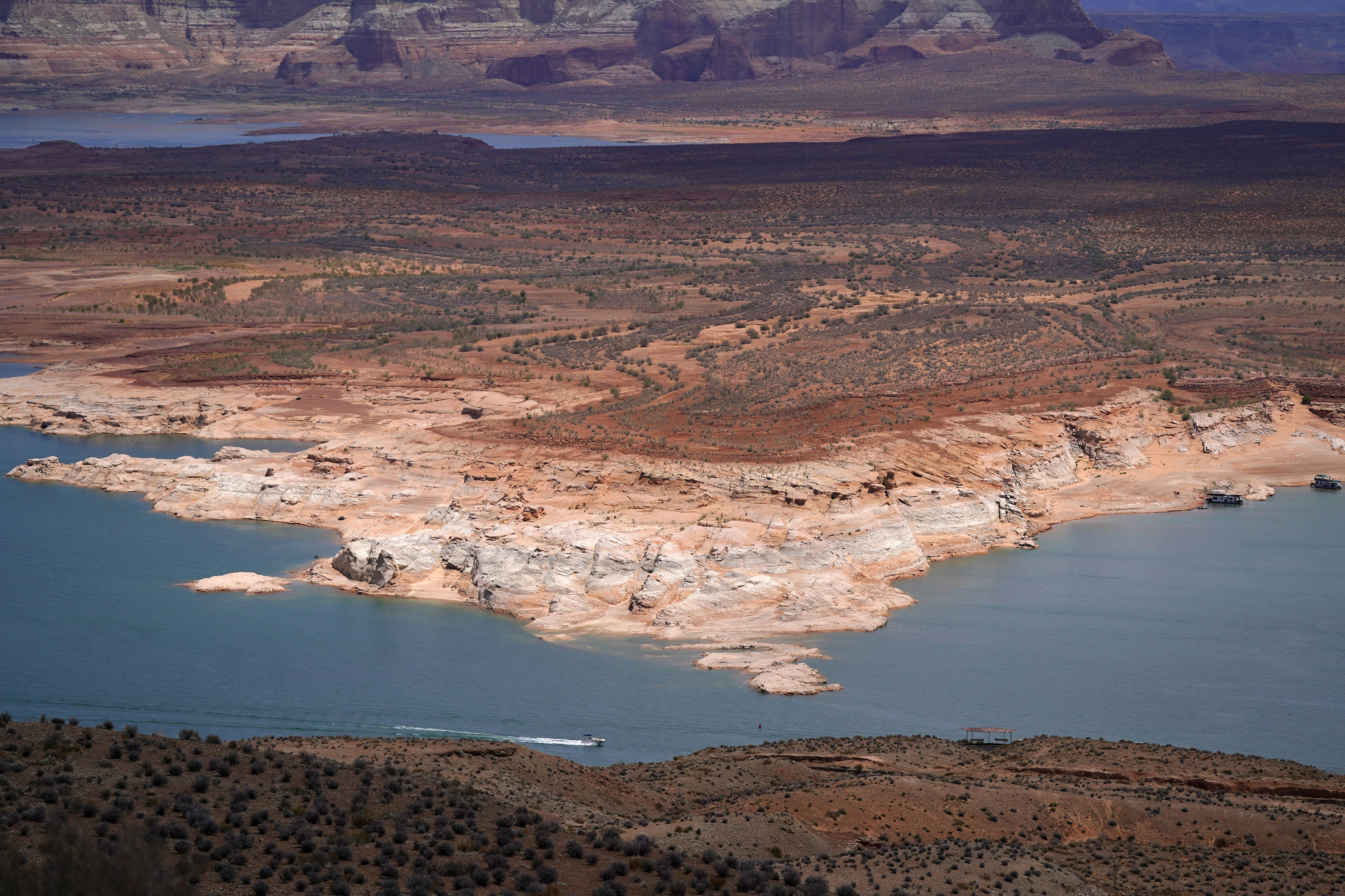 A boat moves along Wahweap Bay along the Colorado River 